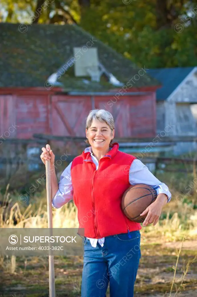Portrait of a mature woman holding a basketball, Bozeman, Montana, USA