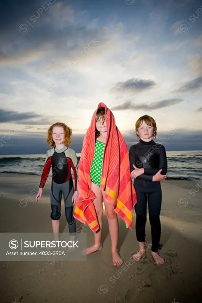 Children standing on the beach, San Diego, California, USA