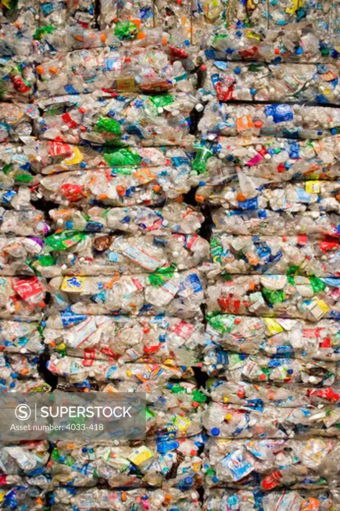 Stacks of crushed recyclable plastic bottles