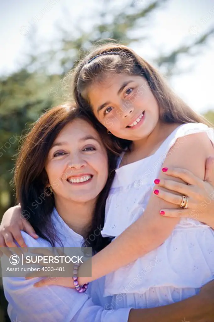 Mature woman smiling with her granddaughter