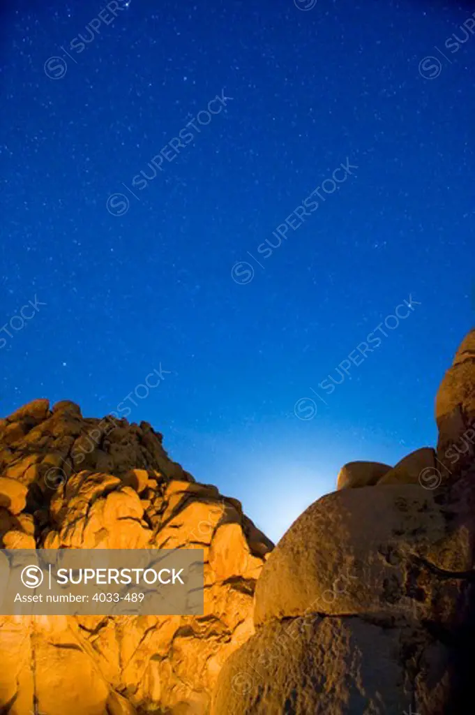 Boulders lit up at night, Joshua Tree National Monument, California, USA
