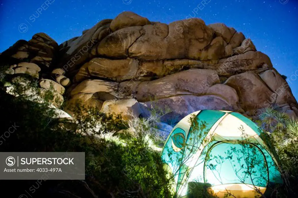 Dome tent lit up at night, Joshua Tree National Monument, California, USA