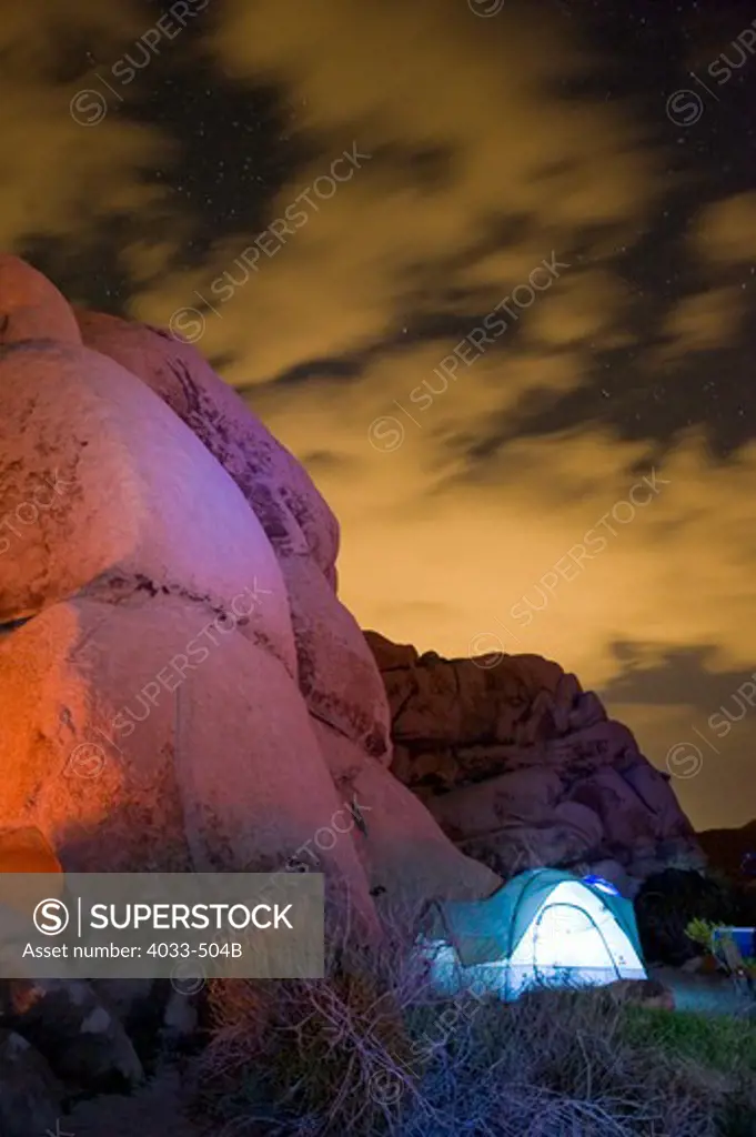 Dome tent lit up at night, Joshua Tree National Monument, California, USA