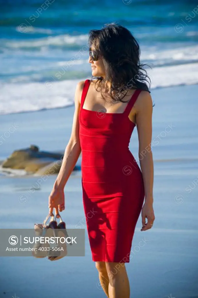 Mid adult woman walking on the beach