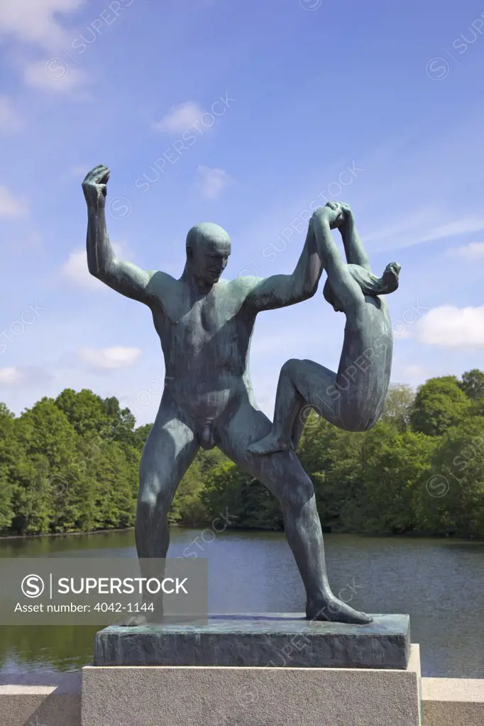 Norway, Oslo, Vigeland Sculpture Park, statue of father and daughter playing