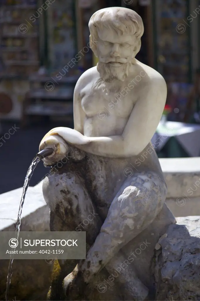 Italy, Amalfi, sculpture in fountain