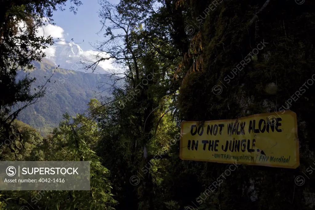 Sign saying 'Do Not Walk Alone In The Jungle', Tadapani, Ghandruk, Annapurna Sanctuary, Himalayas, Nepal