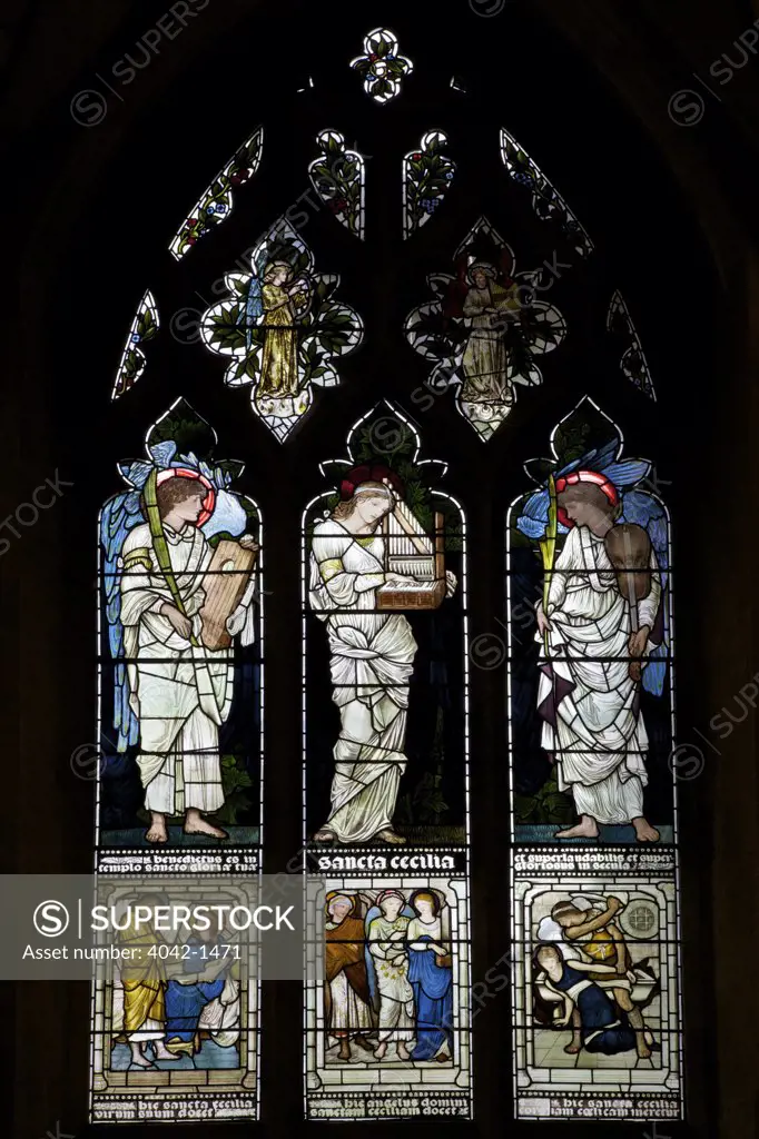 Saint Cecilia and Two Angels by Edward Burne-Jones on stained glass windows in a church, Christ Church, Oxford University, Oxford, Oxfordshire, England