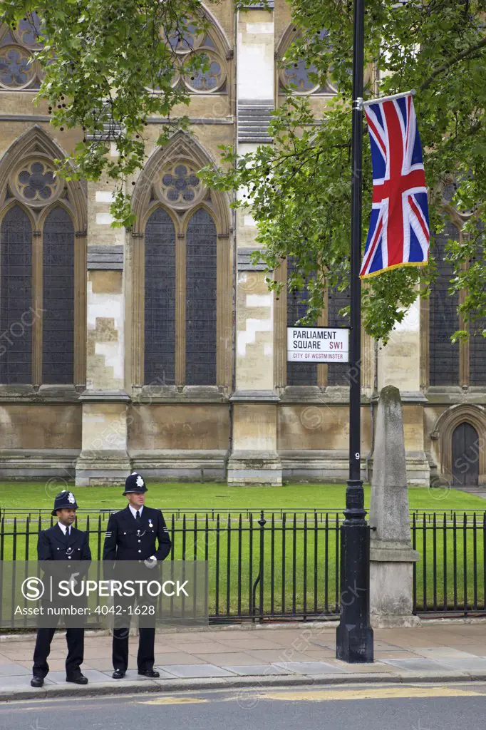 Two police officers in Parliament Square standing guard outside Westminster Abbey during the marriage of Prince William to Kate Middleton on 29th April 2011, London, England