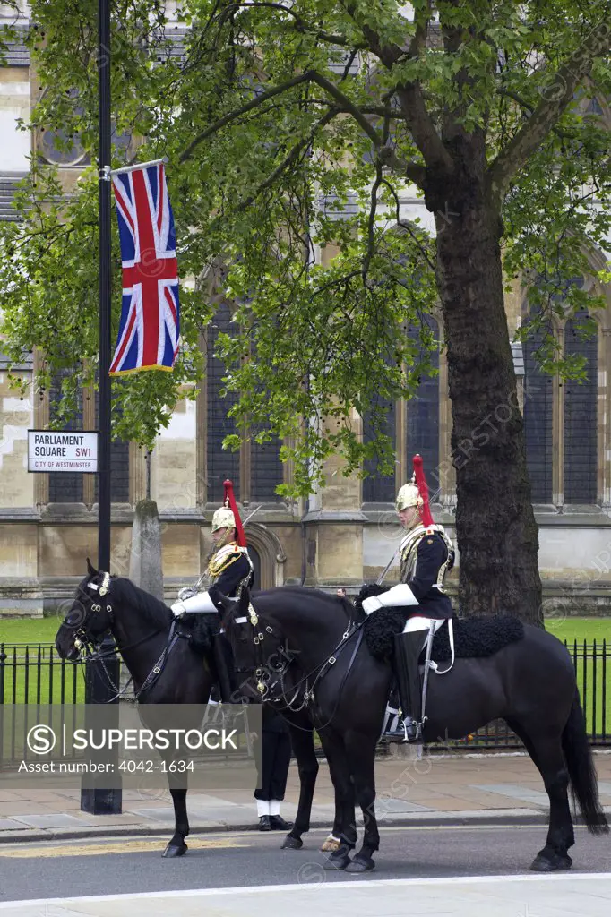 Members of the British Royal Navy and Metropolitan Police stand guard outside Westminster Abbey during marriage of Prince William to Kate Middleton on 29th April 2011, London, England