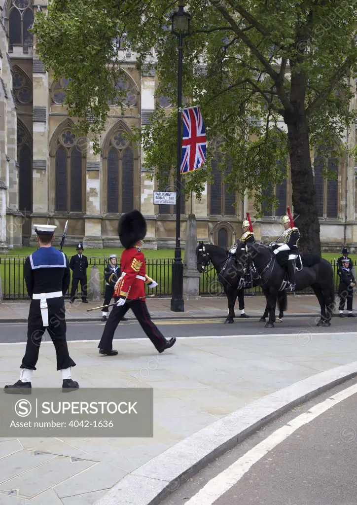 Members of the British Royal Navy and Metropolitan Police stand guard outside Westminster Abbey during marriage of Prince William to Kate Middleton on 29th April 2011, London, England