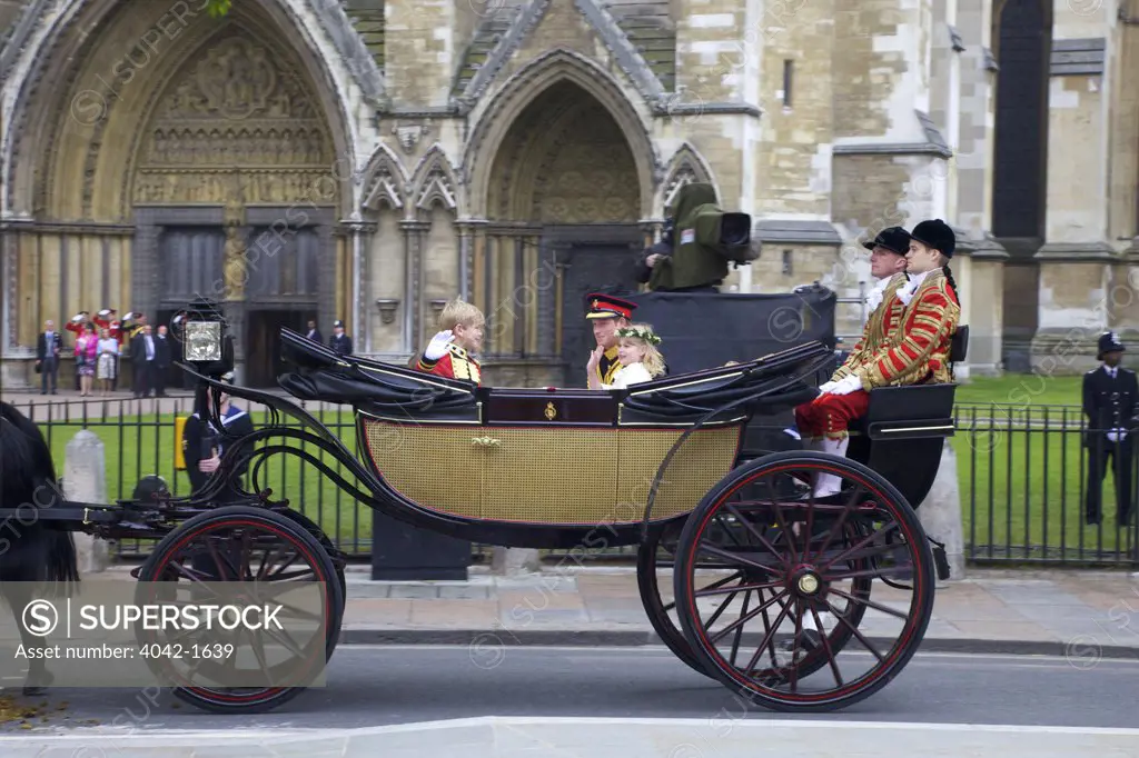Prince Harry and Lady Louise Windsor with Tom Pettifer travelling in Ascot Landau carriage outside of Westminster Abbey for participating in marriage of Prince William to Kate Middleton on 29th April 2011, London, England