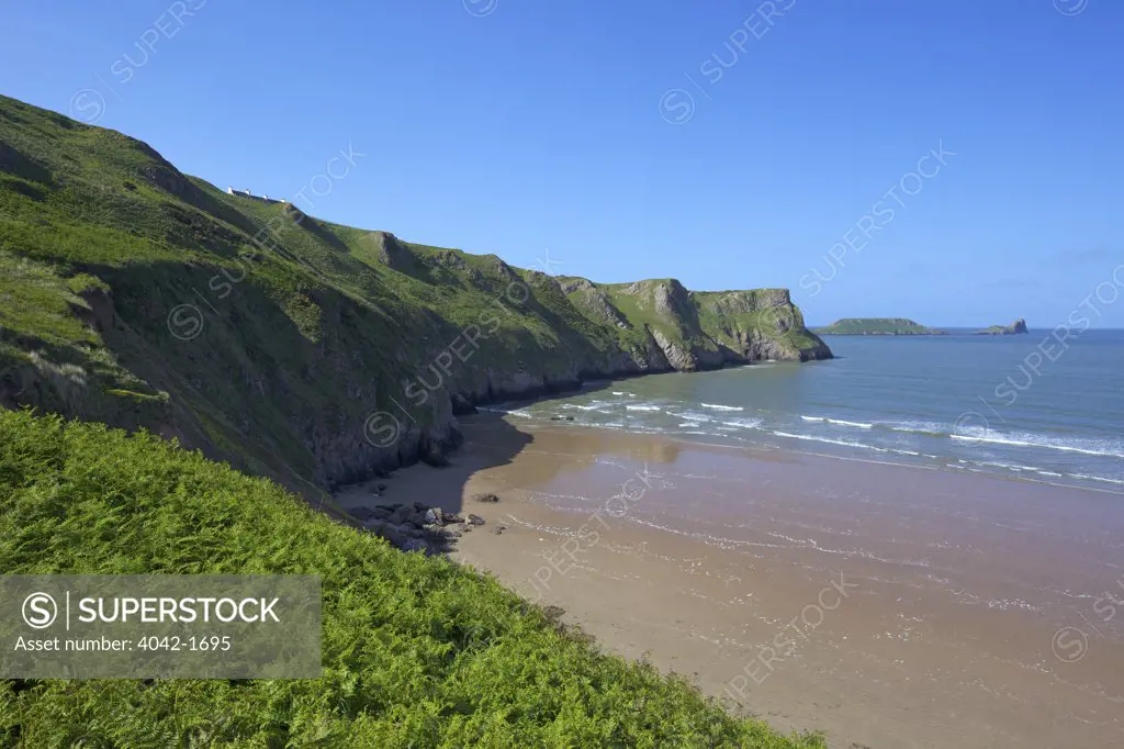 Coastline at dawn, Worm's Head, Rhossili Beach, Gower Peninsula, Swansea, Wales