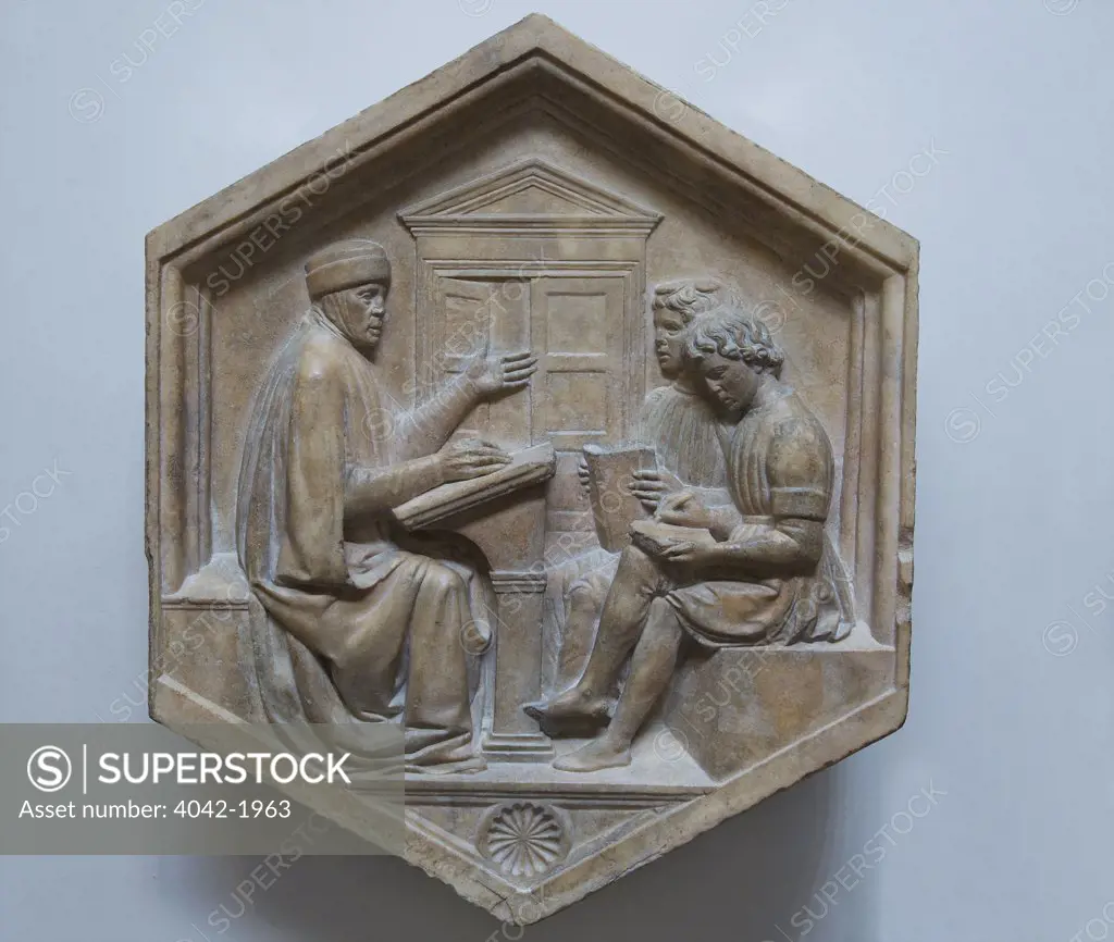 Grammar with Priscian teaching two boys, by Luca della Robbia, original relief from the Campanile, Museo dell'Opera del Duomo, Florence, Tuscany, Italy, Europe