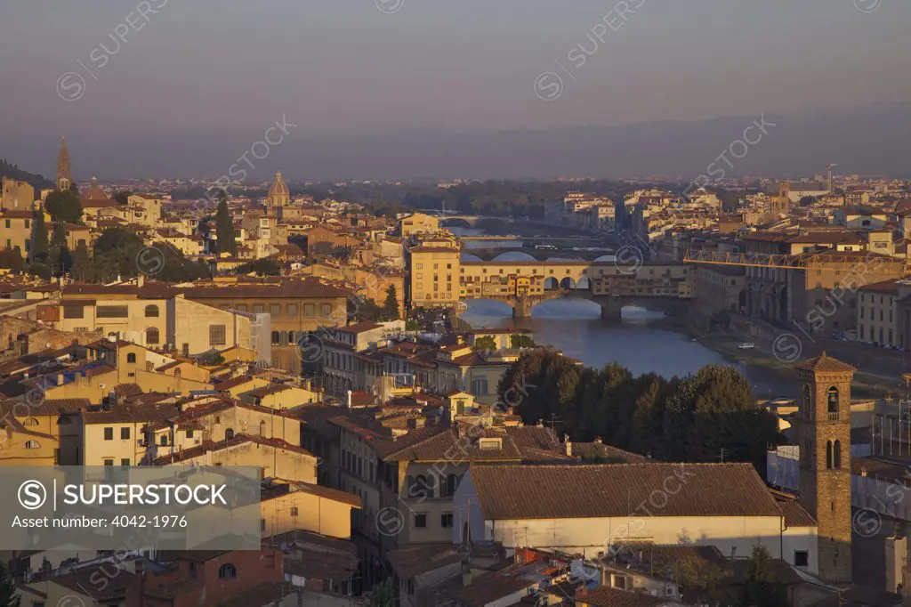 High angle view of Ponte Vecchio bridge across River Arno viewed from Piazzale Michelangelo at dawn, Florence, Tuscany, Italy