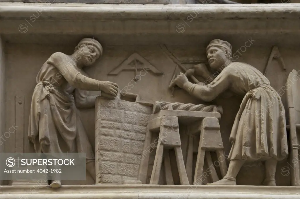 Carpenters at work, marble relief frieze, exterior of Orsanmichele, Florence, Tuscany, Italy, Europe