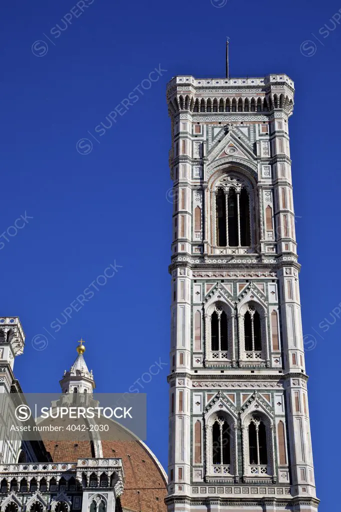 Low angle view of Campanile di Giotto and Brunelleschi's dome for the Duomo Santa Maria Del Fiore, Florence, Tuscany, Italy
