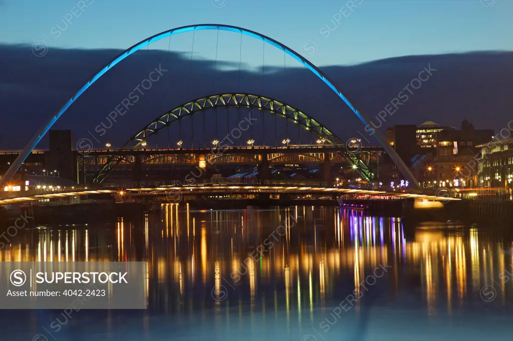Gateshead Quays with Sage Gateshead and Gateshead Millennium Bridge over the Tyne River at dusk, Gateshead, Tyne And Wear, England