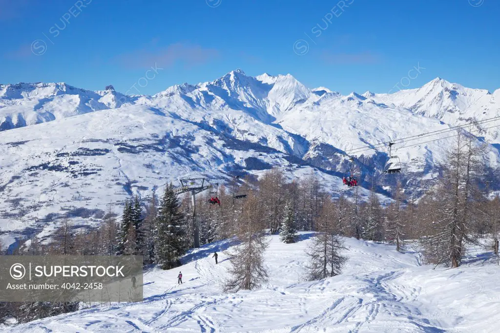 Ski lifts and skiers at Peisey-Vallandry, Les Arcs, Savoie, Rhone-Alpes, France