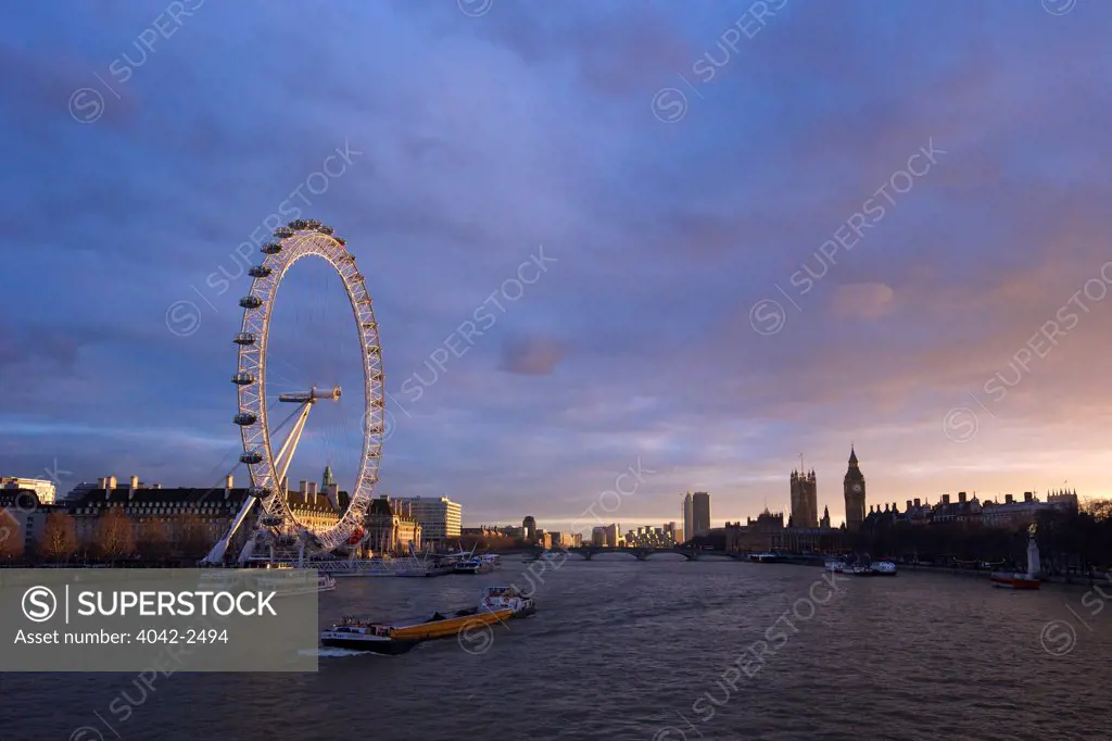 London Eye from Hungerford Bridge at sunset, River Thames, Big Ben, Houses of Parliament, London, England