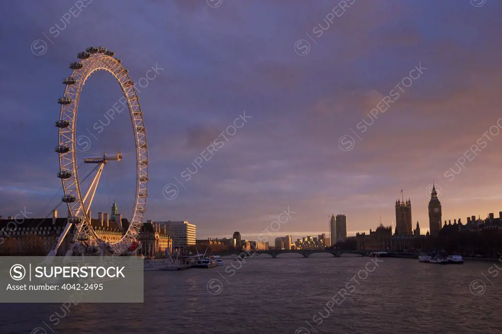 London Eye from Hungerford Bridge at sunset, River Thames, Big Ben, Houses of Parliament, London, England
