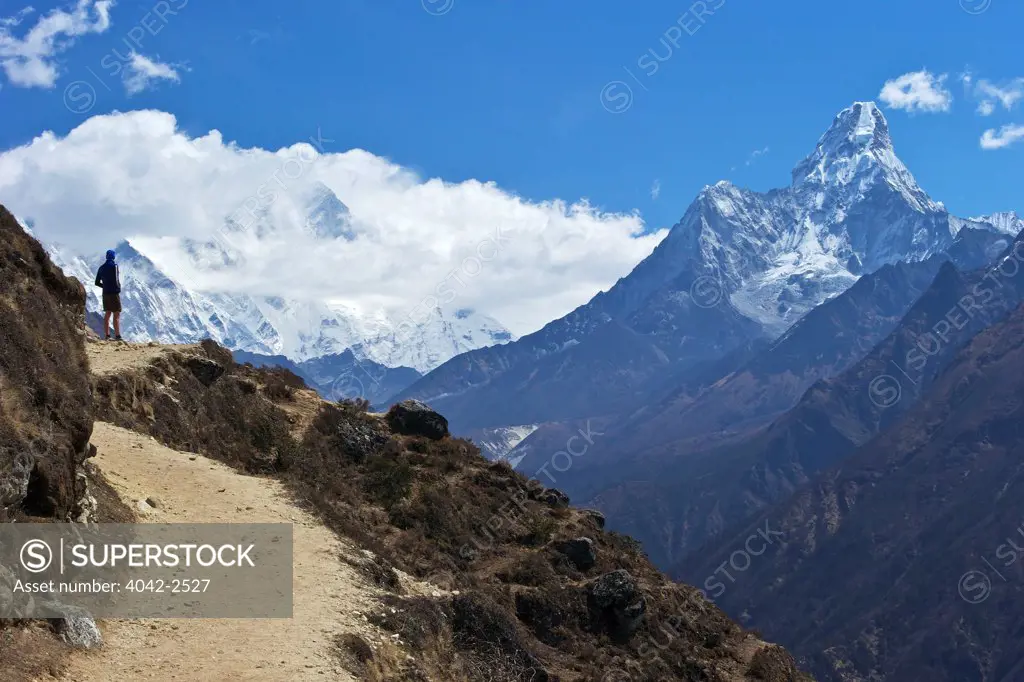 Trekker looking to Mount Everest and Lhotse with Ama Dablam, Nepal