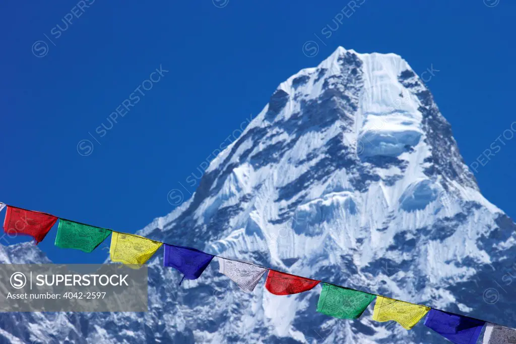 Buddhist prayer flags against Ama Dablam, Nepal