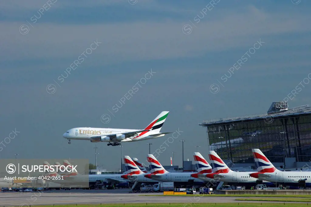 Emirates flight landing at Terminal 5, Heathrow Airport, London, England