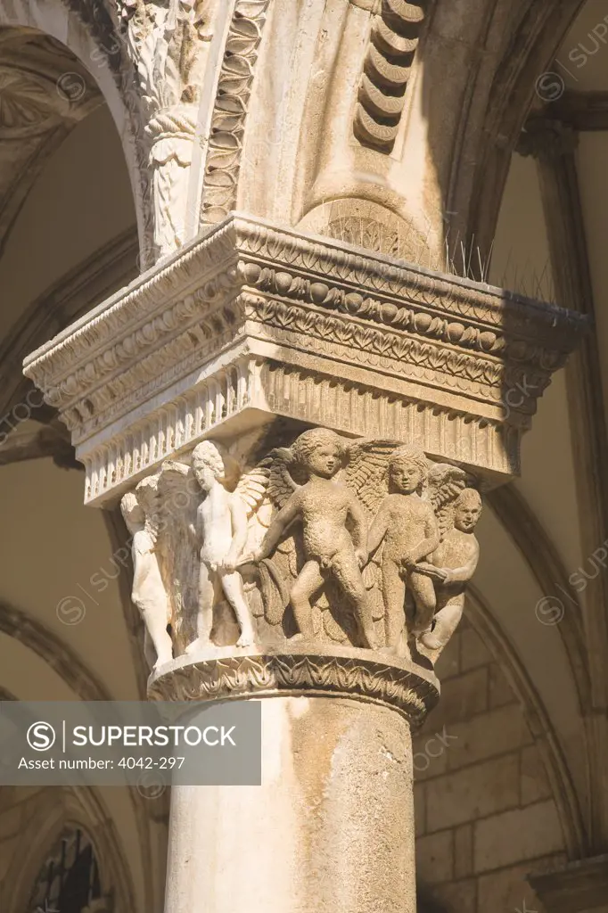 Ornate column with carved cherubs, Rector's Palace, Dubrovnik, Croatia