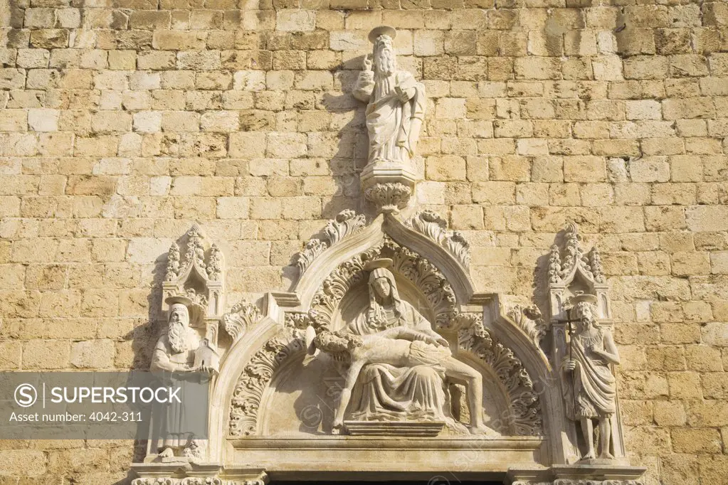 Croatia, Dalmatia, Dubrovnik, Sculpture on main portal of Franciscan Church