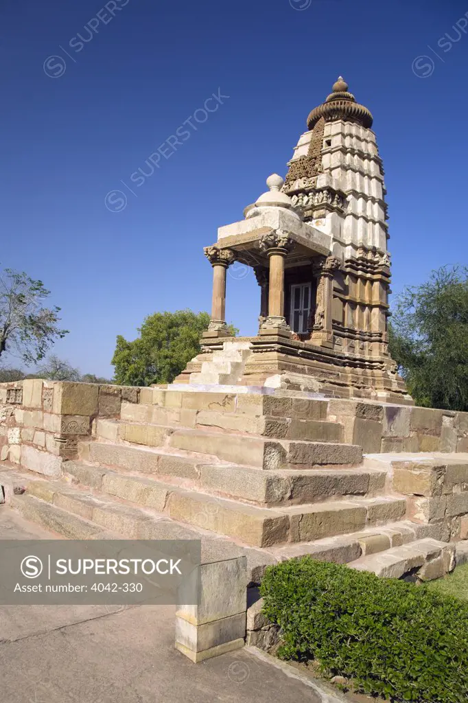 Low angle view of a temple, Devi Temple, Khajuraho, Madhya Pradesh, India