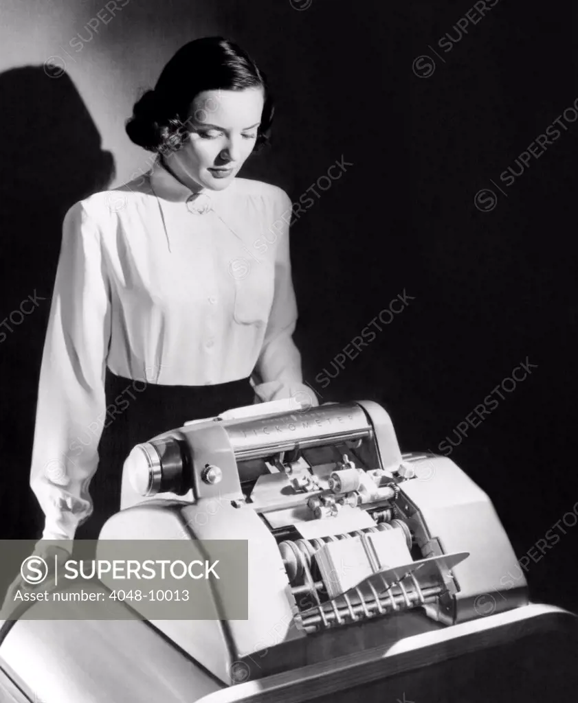 Mechanized currency counter, the 'Tichometer' accurately counts dollar bills at the rate of 1000 per minute. The mechanism was so sensitive that it once detected a counterfeit bill in the middle of a big run of currency, Oct. 22, 1949.