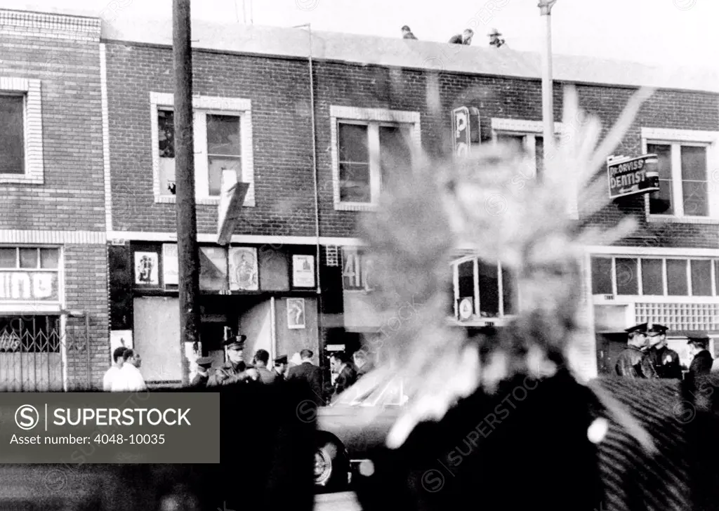 A bullet hole in a storefront window was made during four hours exchange of gunfire between Los Angeles Police and Black Panthers. Dec. 8, 1969.