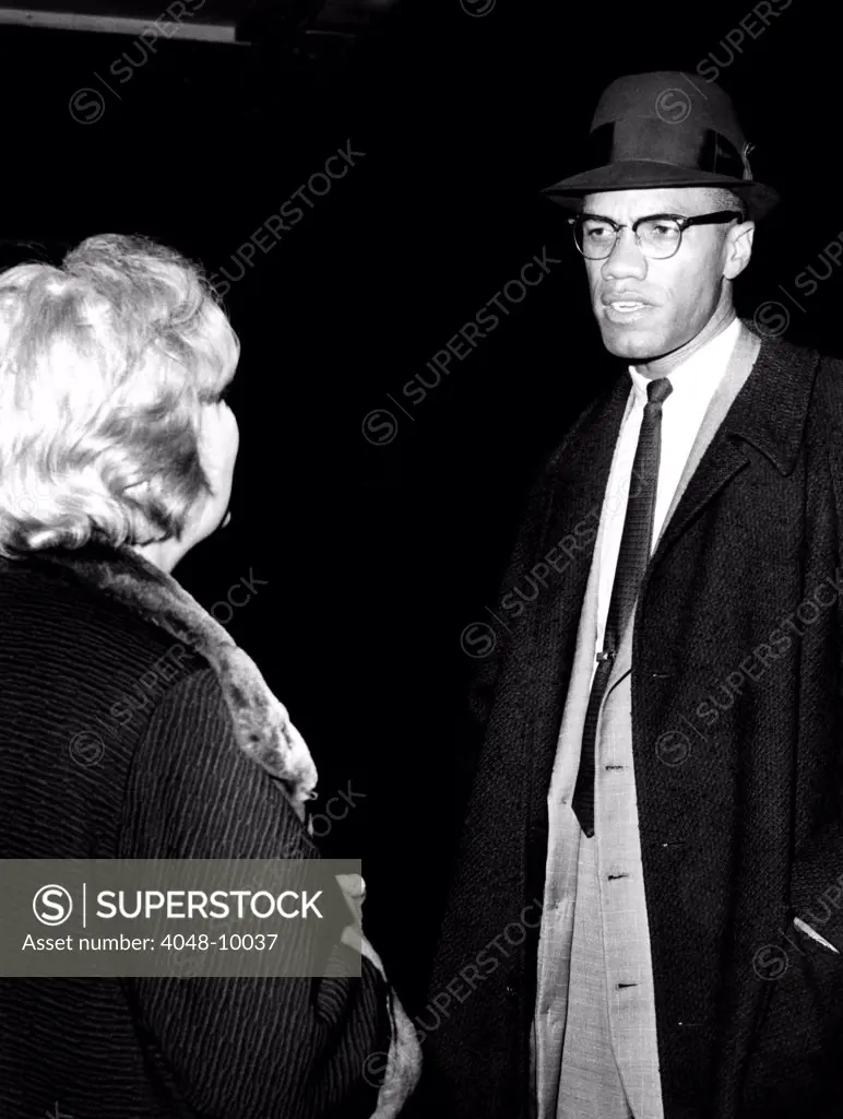 Malcolm X talks to a woman reporter following his television appearance in New York City. March 9, 1964