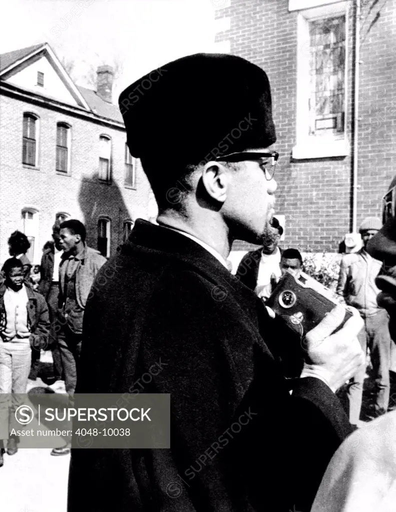Malcolm X visits the voting rights protest in Selma, Alabama. He is about to photograph the church in which he spoke to protesters. Feb. 4, 1965.