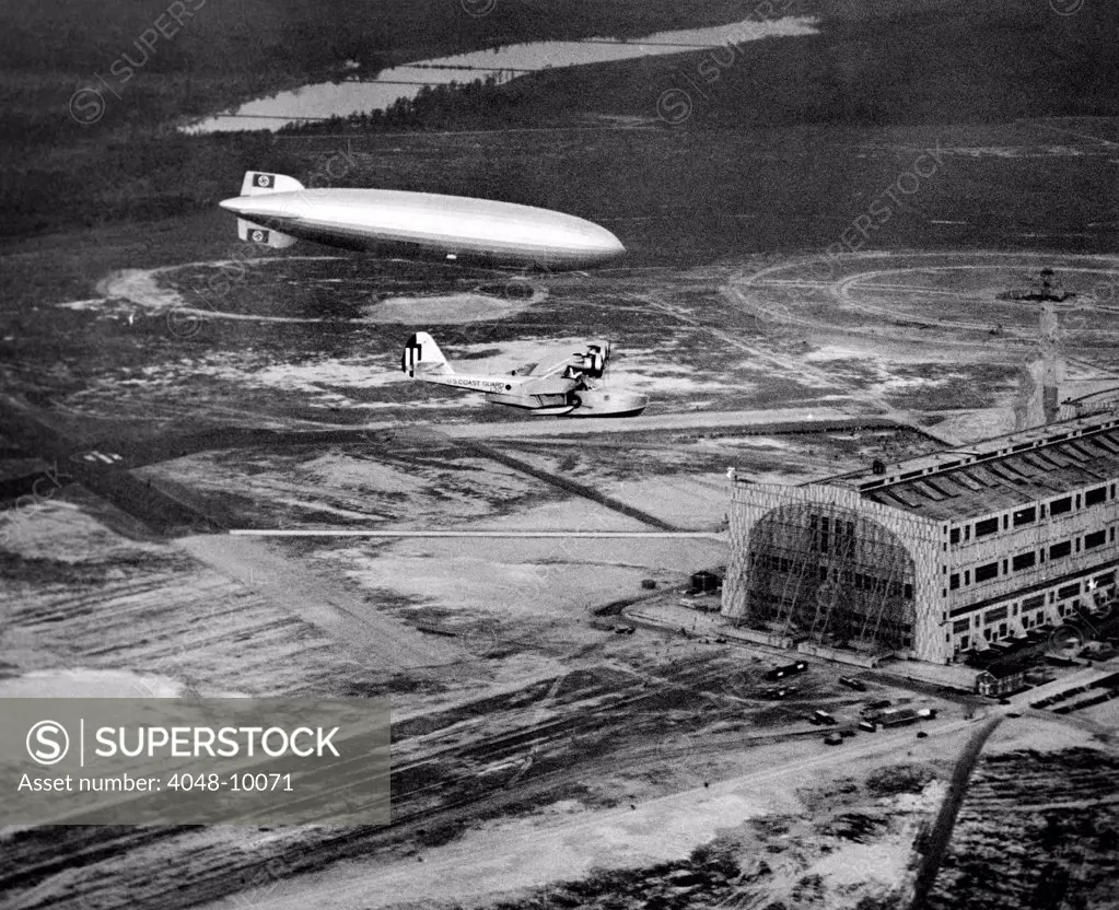 Hindenburg's arrival with an escort plane over Lakehurst, New Jersey. Minutes later it exploded and crashed. May 6, 1937.
