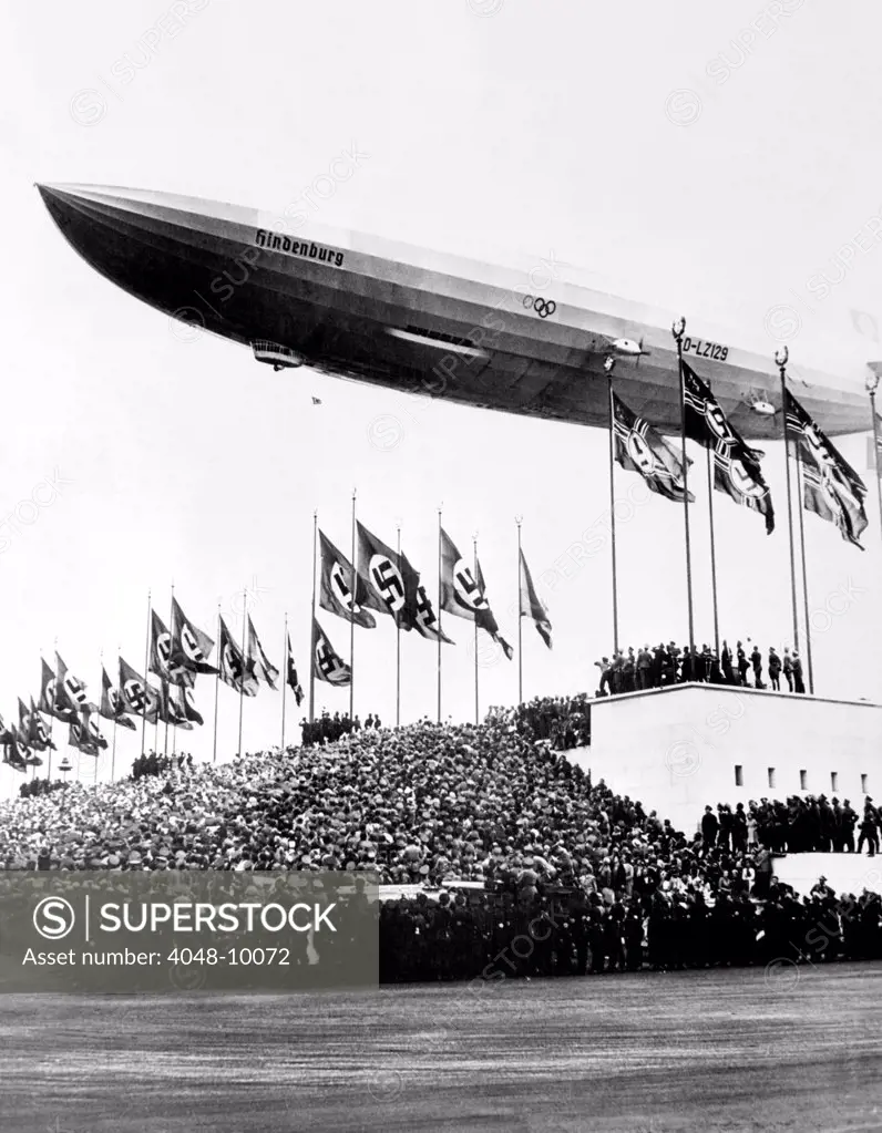 The Hindenburg, flying low in salute of the Nazi hosts of the Nuremberg Congress. Shortly afterward it departed for the United States. October 20, 1936.
