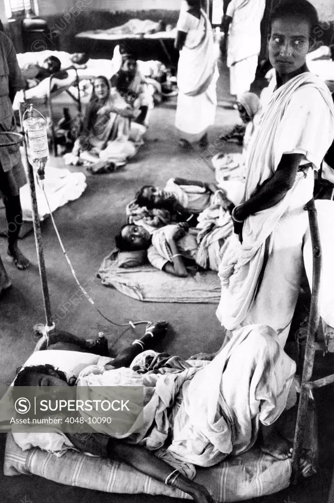 A women refugee from the Bangladesh Liberation War. She receives intravenous medicine in the Bongaon Subdivision Hospital near Calcutta. Nov. 1971.