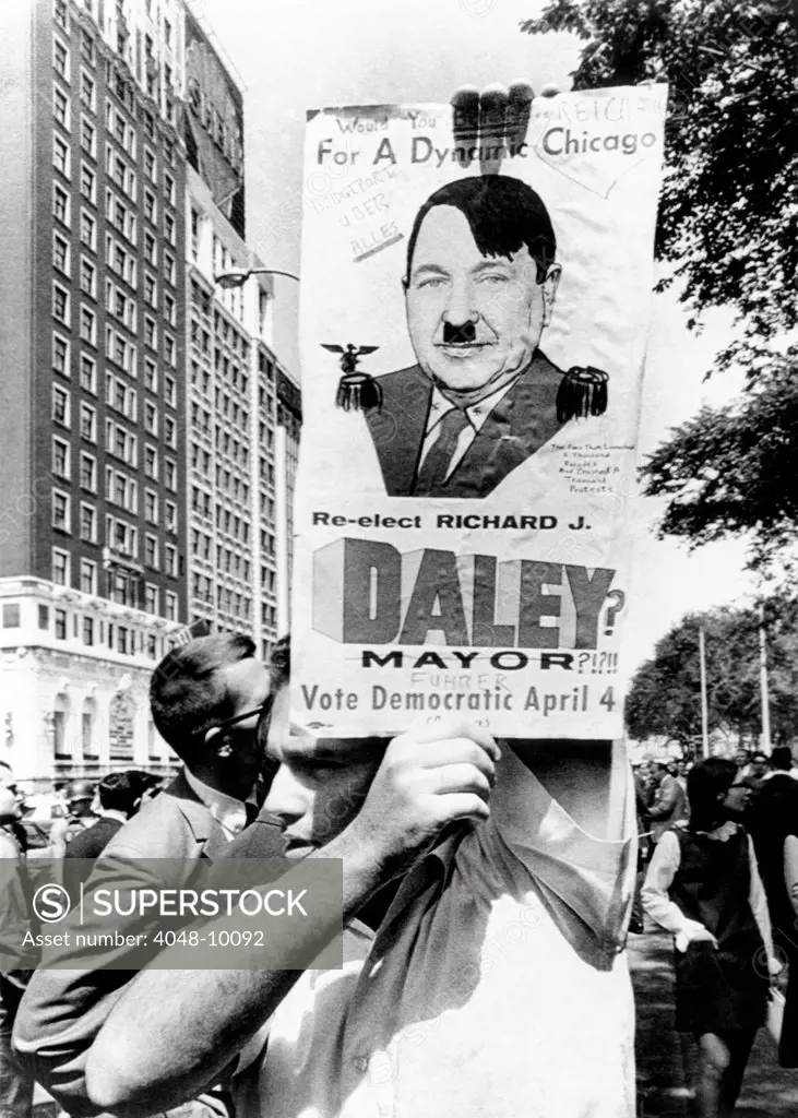 An old campaign poster of Chicago Mayor Richard Daley, with a few new touches. Protesters have added hair, swastikas on the collar, epaulettes, and some scrawled comments about the 'Fuhrer'. Sept. 29, 1968