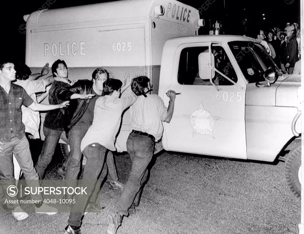 Battle of Michigan Avenue' in Chicago, during the 1968 Democratic National Convention. Anti-war demonstrators try to push over a Chicago Police vehicle. Aug. 29, 1968