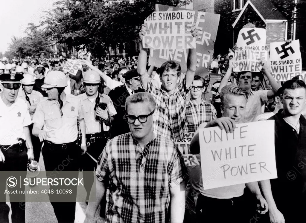 Counter demonstrators for 'White Power' in Gage Parks section of Chicago. 500 protesters opposed civil rights marchers seeking open housing in Chicago and its suburbs. More than 500 marchers participated. Aug. 14, 1966.