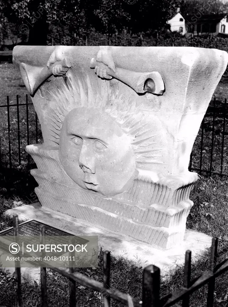 Surviving sunstone at the reconstructed Mormon Temple at Nauvoo, Illinois. It depicts sun face emerging between clouds beneath a pair of hand-held trumpets. They are believed to be inspired by Paul's writing in 1 Corinthians 15:40-42 which likened the glory of the heavenly kingdoms to that of the sun, the moon and the stars. The stone was carved in the 1840s.