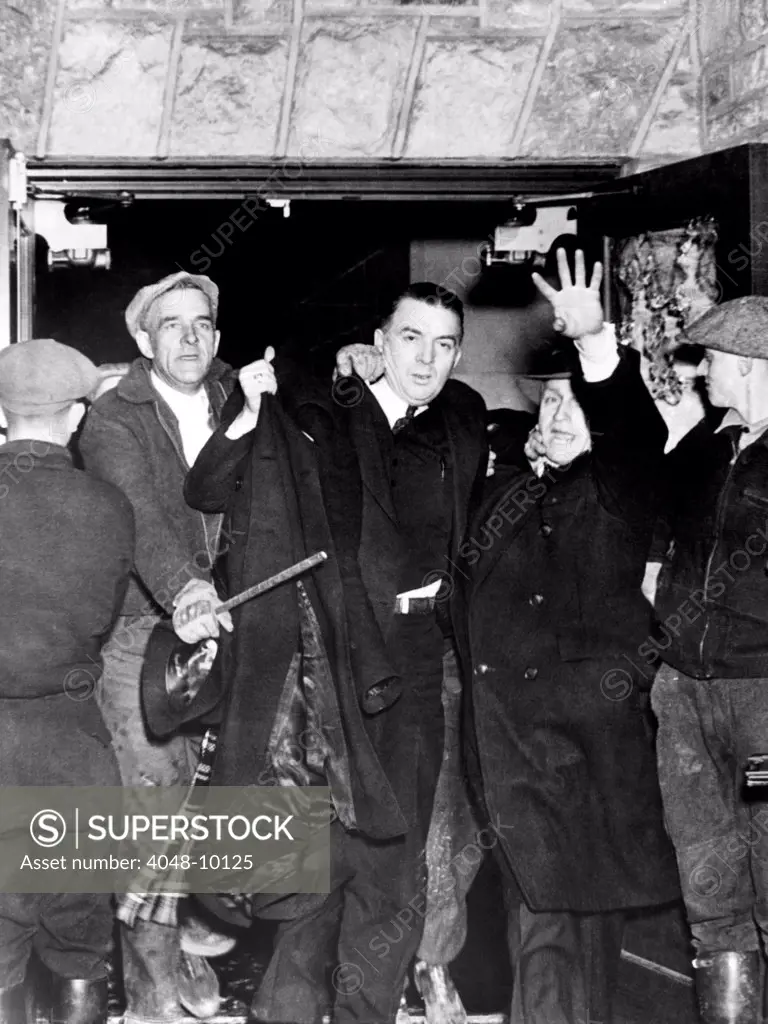 Strike against the Hershey Chocolate Company. Miles Sweeney, the CIO strike leader at the Hershey Chocolate Plant, is ejected by a mob of non-striking workers and local farmers. April 7, 1937.