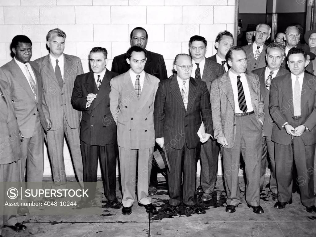 Eleven of the American Communist Party's top leaders. Federal Court where they were convicted of found guilty of conspiring to teach the overthrow of the U.S. government by violence. L-R: Henry Winston, Eugene Dennis, Jacob Stachel, Gilbert Green, Benjamin Davis, John Williamson, Robert Thompson, Gus Hall, Irving Potash, Carl Winter, and John Gates. Dec. 6, 1949.