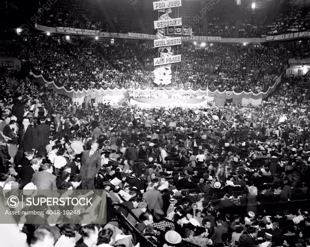 Communist Party Nominating Convention. Gathered in Madison Square Garden, they nominated Earl Browder for President, and James W. Ford for Vice President. A banner reads, 'For Jobs, Security, Civil Rights, and Peace'. June 2, 1940.