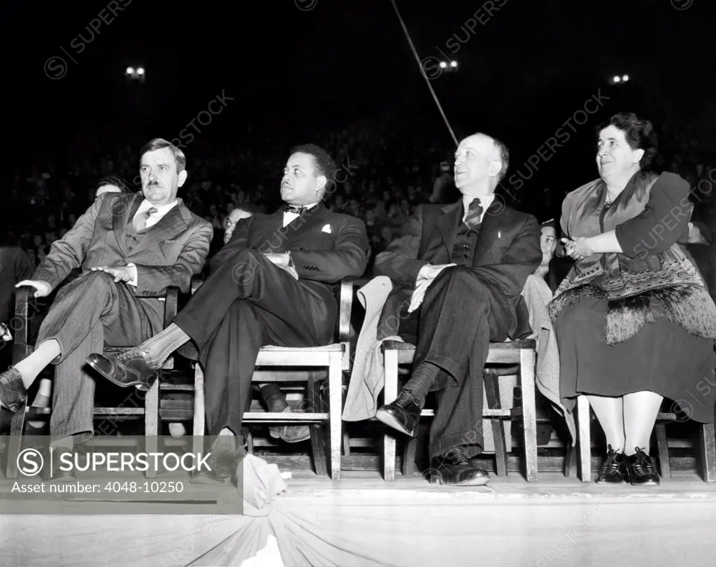 US Communist leaders at a Madison Square Garden pre-election rally. L-R: Earl Browder, Communist Party Presidential candidate, James W.. Ford, Vice-Presidential candidate, William Z. Forster, National Chairman, Elizabeth Gurley Flynn, Communist Party National Committee member. Nov. 3, 1940.