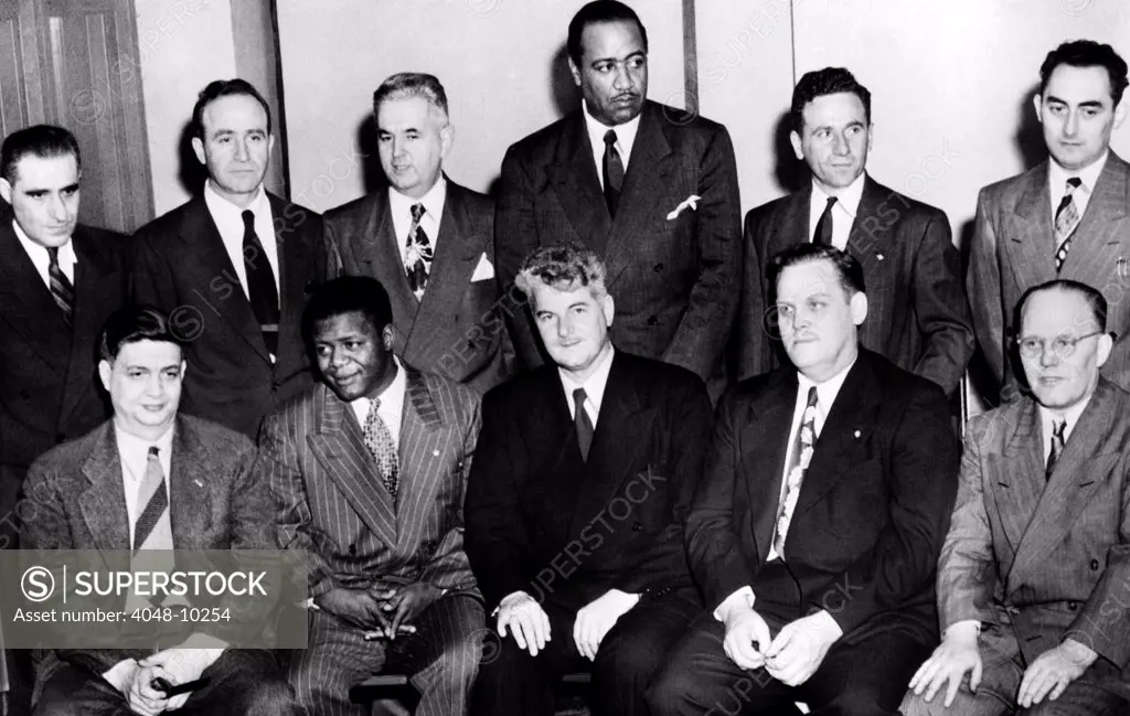 Communist Leaders who were on trial in 1949. L-R: Front: Robert Thompson, Henry Winston, Eugene Dennis, Gus Hall, John Williamson. Back Row: Jacob Stachel, Irving Potash, Carl Winter, Ben Davis Jr., John Gates, Gilbert Green. Jan 17, 1949.