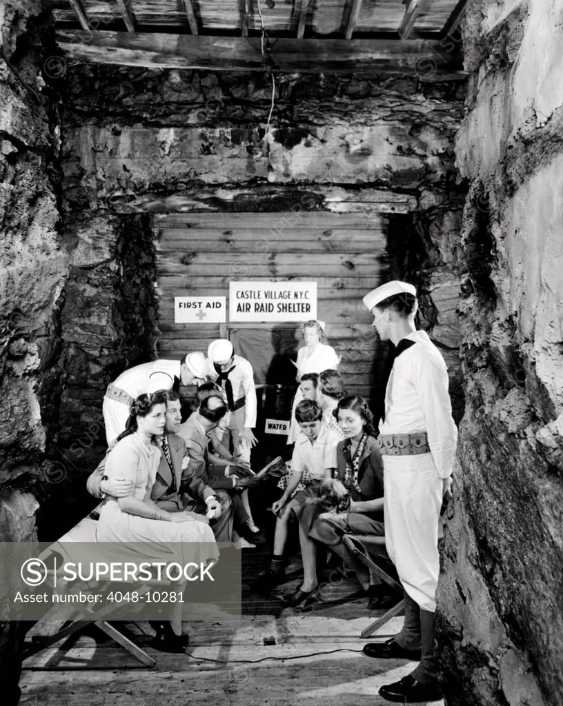 New York City's' first World War II air raid shelter. It is a total bomb-proof shelter in a 100 foot high solid rock cliff near Castle Village, a multi-building apartment complex in Washington Heights. A cot, first aid kits, benches, tables, lights, and water are available in the shelter. July 19, 1940.