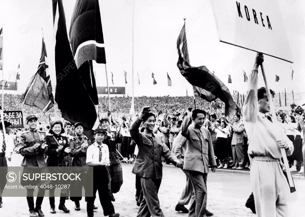 North Korean delegates to the Communist World Youth Festival. Some of the Koreans wear army uniforms and decorations awarded to them in the Korean War against the United Nations. East Berlin. Aug. 8, 1951