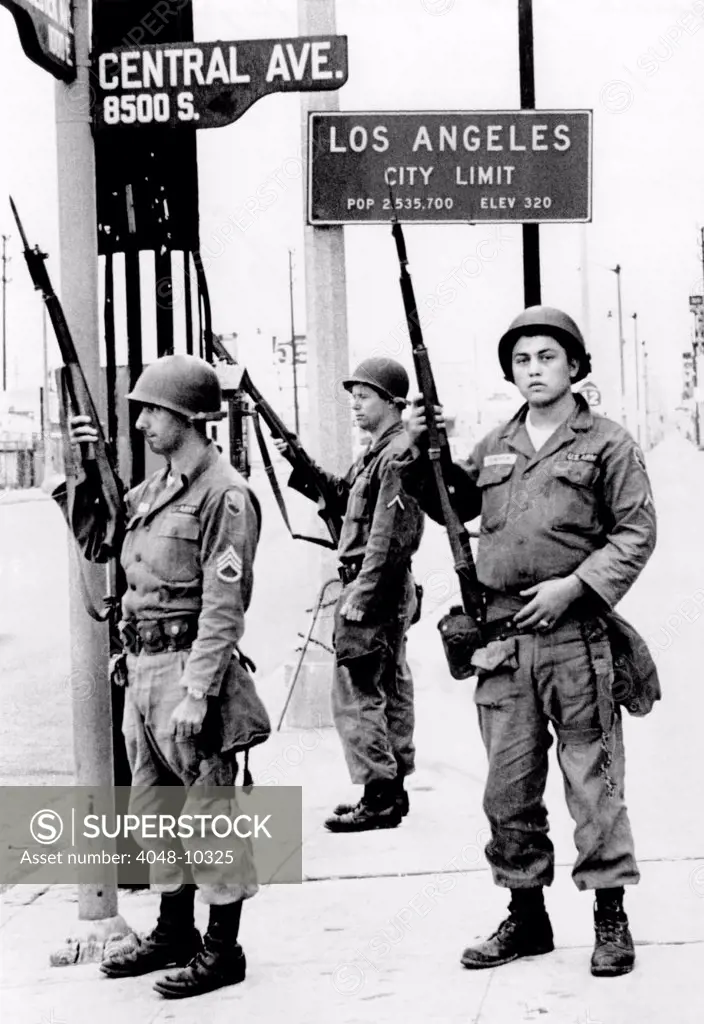 National Guardsmen at a Los Angeles City Limits. As the 1965 Watts Riots subsided, National Guardsmen still stand by until recalled by Gov. Edmund Brown. August 17, 1965.